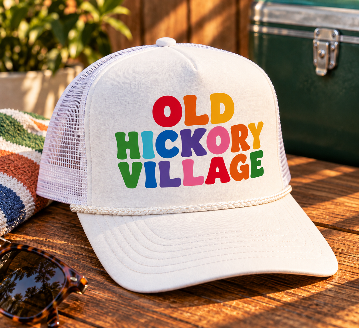 Local Villager Rainbow Trucker hat in white with multicolor Old Hickory Village graphic